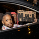 Children carry a sign at a Black Lives Matter protest as it makes it’s way through downtown in response to the police shooting of MaKhia Bryant on April 21, 2021 in Columbus, Ohio. The 16-year-old Black girl was shot and killed by police who had been called to the scene of a disturbance. (Photo by Stephen Zenner/Getty Images)
